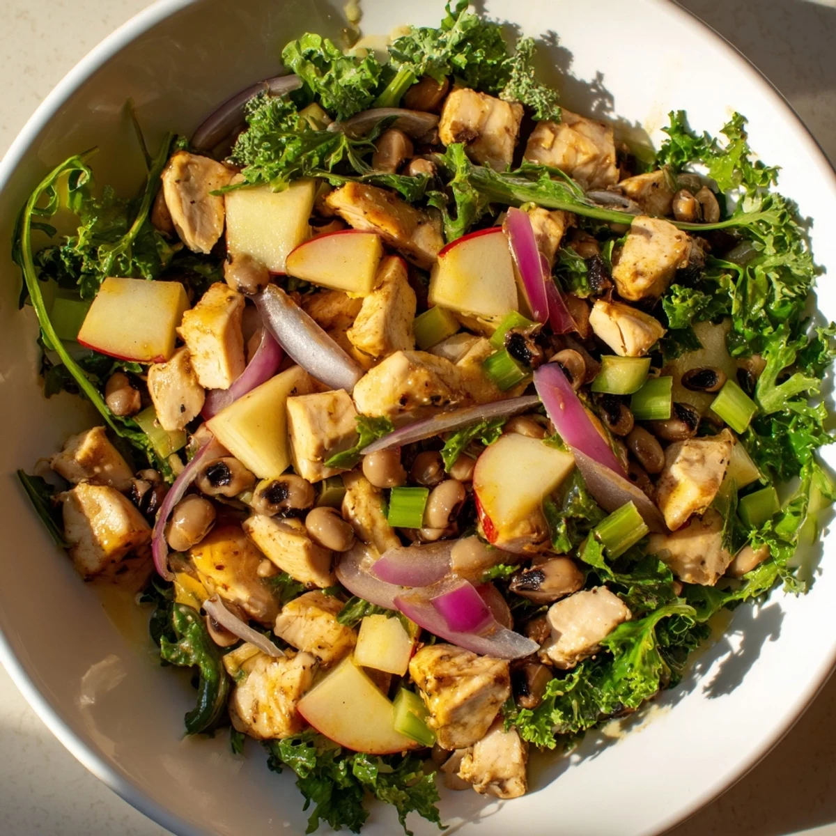 Freshly tossed Chicken and Apple New Years Luck Salad, featuring crisp apples and a creamy dressing, ready to enjoy.