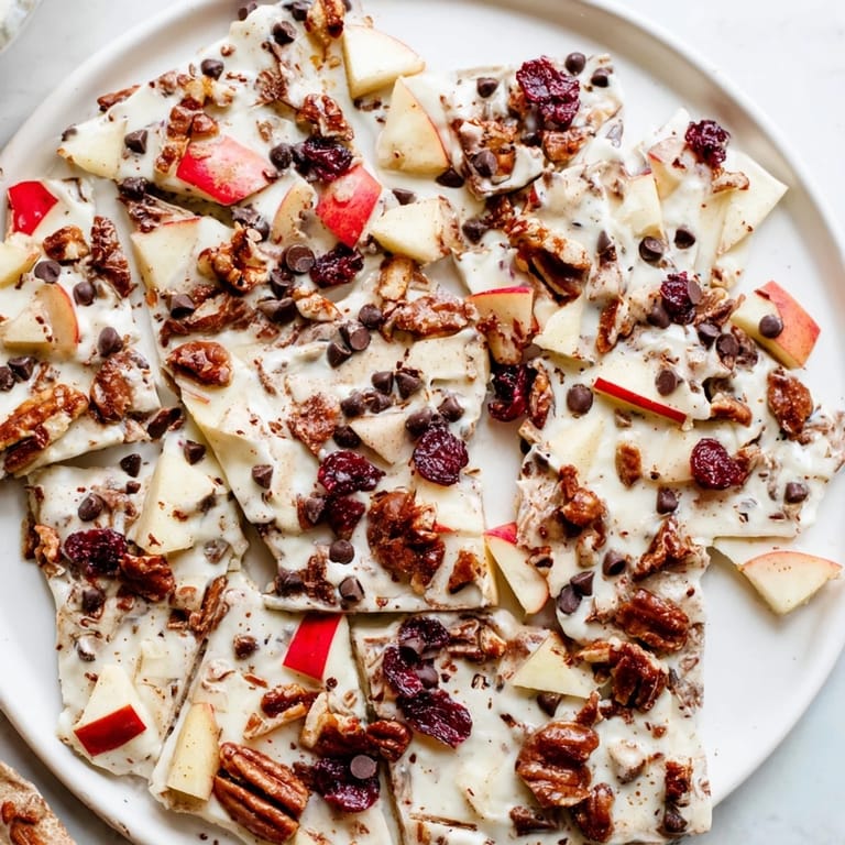 A close-up of delicious Apple Cinnamon Yogurt Bark pieces, layered with fruit and yogurt.